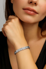 38 close-up shows silver titanium bracelet with zircon finish.