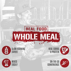 5% Nutrition Rich Piana Real Carbs + Protein shake in glass shows smooth texture and blueberry cobbler flavor.
