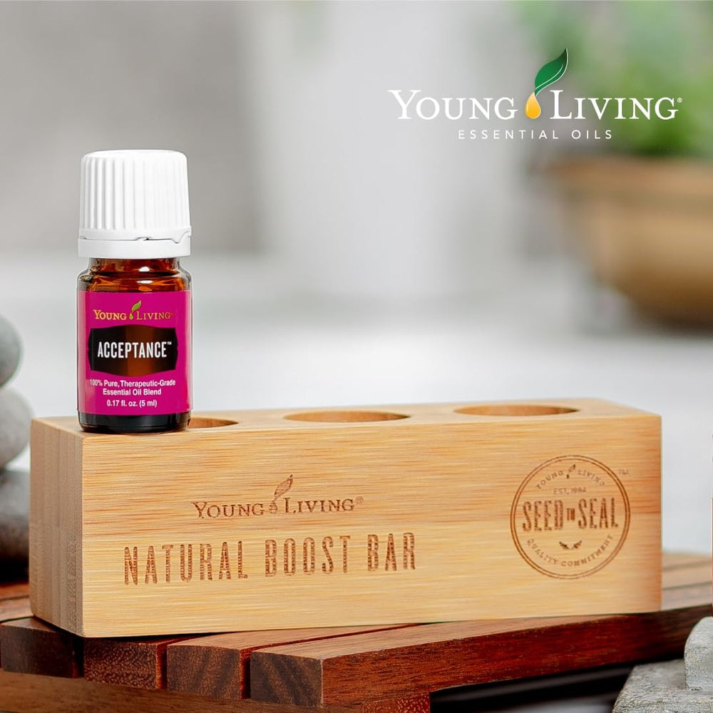Acceptance essential oil bottle on table with diffuser for relaxation.
