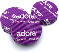 Adora calcium disk visuals showcasing Fairtrade, Kosher, and Non-GMO certifications.