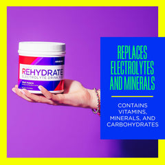 AdvoCare Rehydrate measuring spoon ready to scoop for precise hydration preparation.