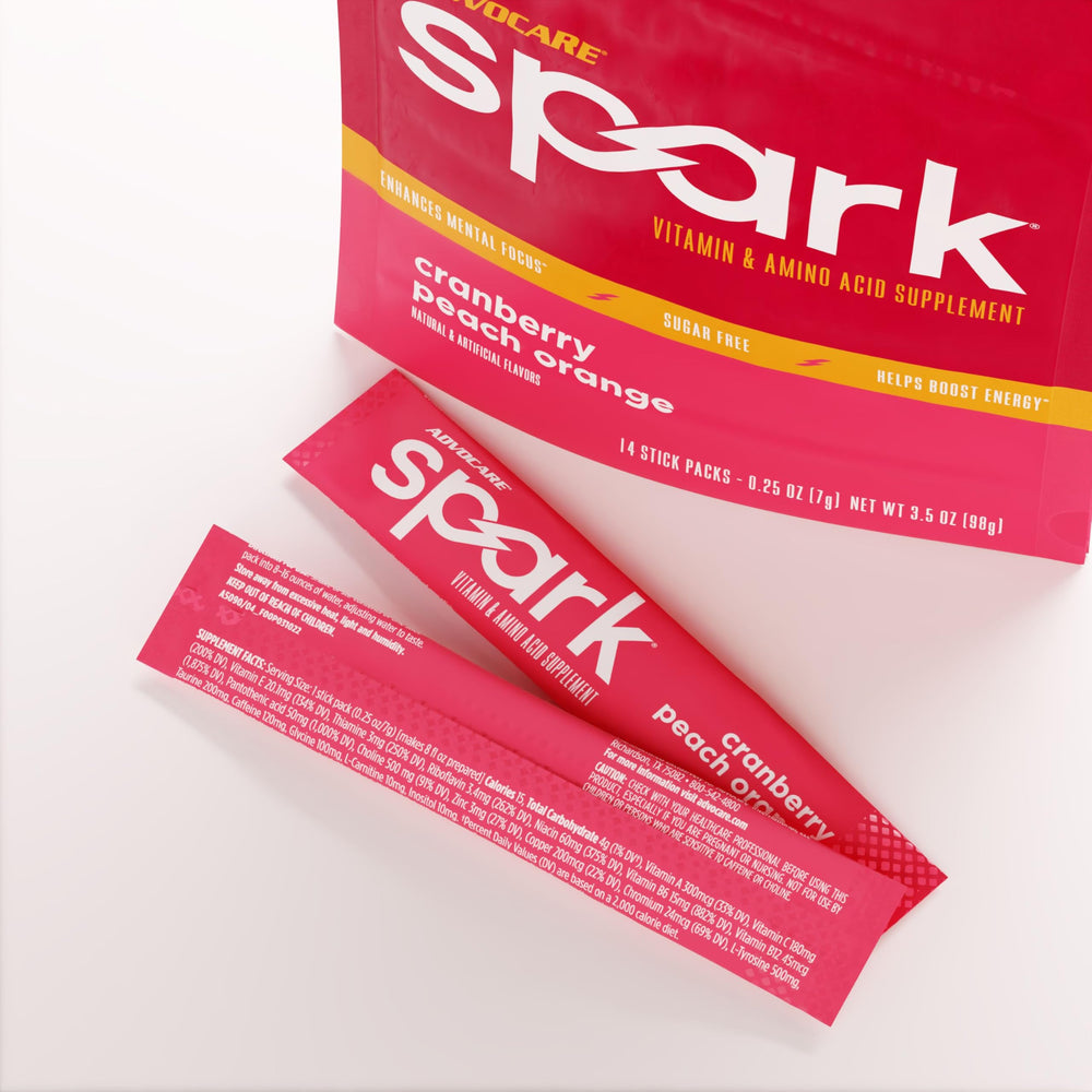 AdvoCare Spark Cranberry Peach Orange in glass highlighting refreshing flavor and immune support