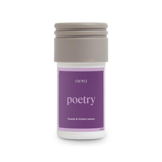 Aera Mini Poetry bottle close-up highlighting suede notes for a calming spa-like aroma.