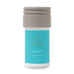 Aera Revive bottle close-up showing juniper berry, rosemary, grapefruit for a refreshing ambiance.