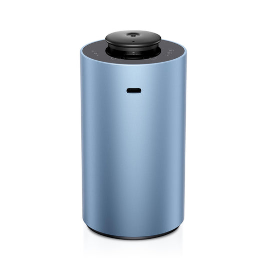 Airversa ANX diffuser in ice blue on tabletop delivering room-filling fragrance
