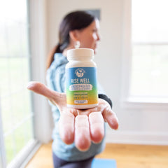 Rise Well B12 sublingual tablet dissolving under the tongue for rapid uptake.