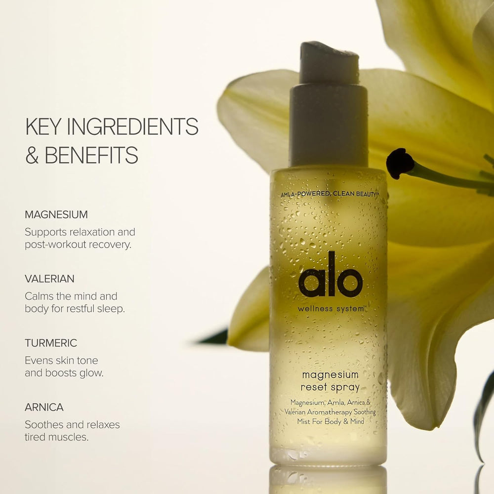 Alo Magnesium Reset Spray close-up showing calming mist on the skin.