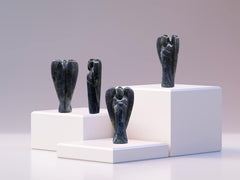 Amazing Gemstone Iolite Angel hand-carved detail highlights natural crystal patterns.