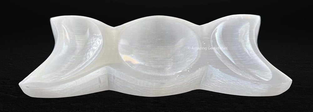 Amazing Gemstone selenite charging plate on an altar, creating a tranquil space.