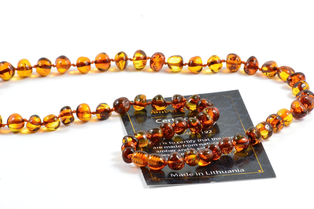 Amber Touch Baltic Amber Necklace polished beads detail emphasizing durability and glow.