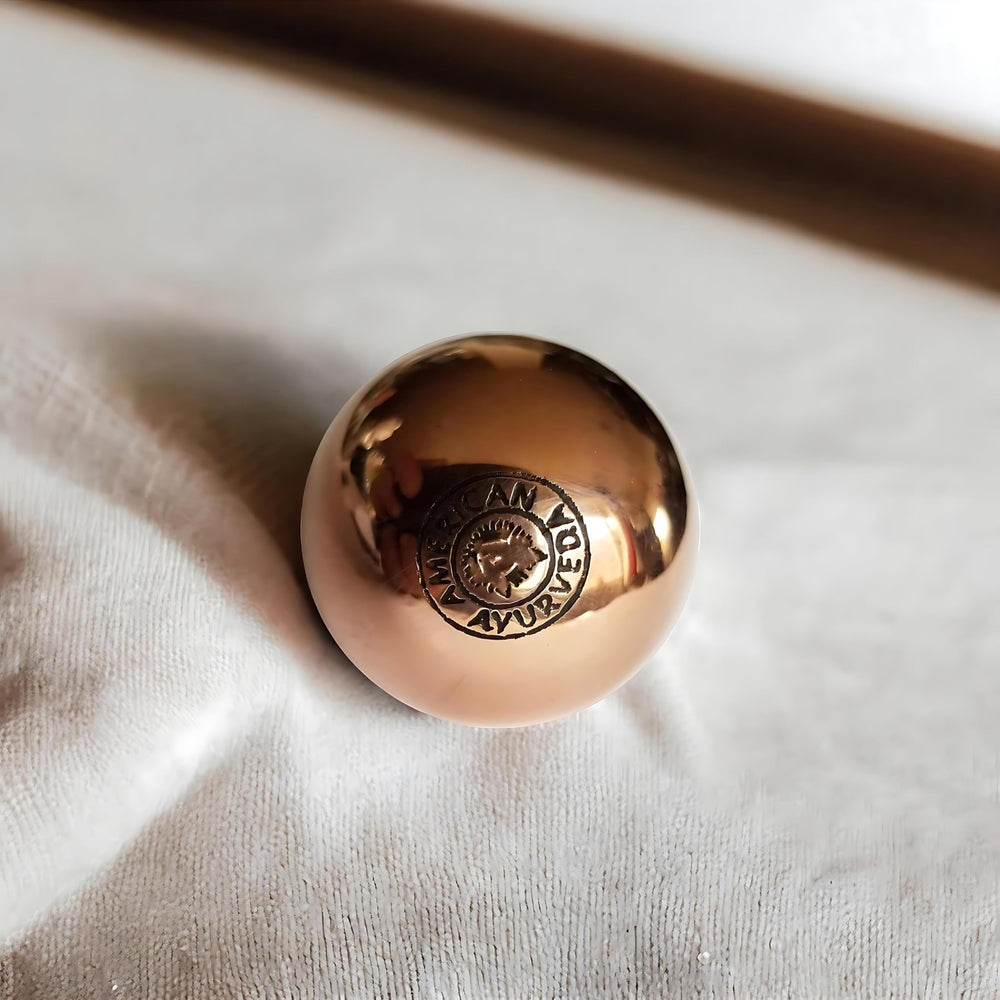 American Ayurveda copper ball grounding energy to balance body and mind.