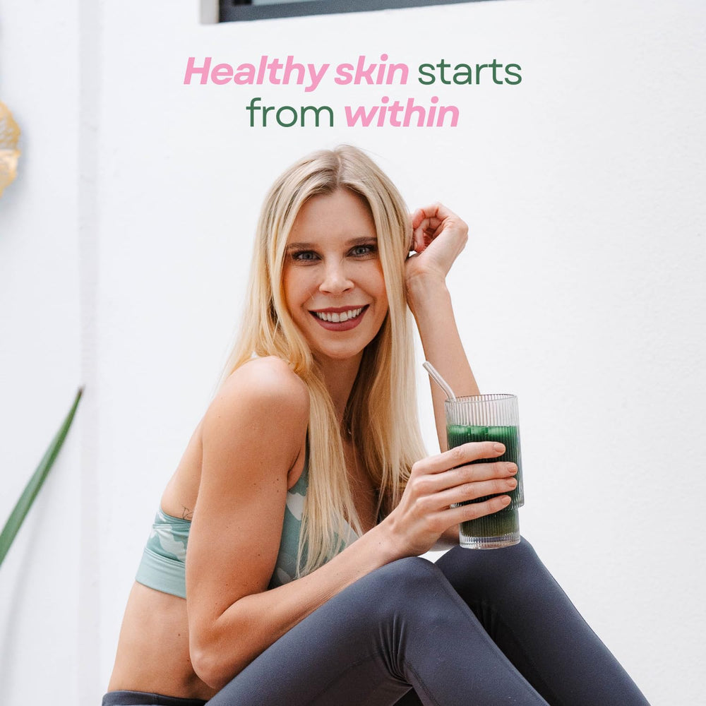 Scoop of Glow Greens powder close-up for daily intake preparation.