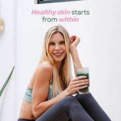Scoop of Glow Greens powder close-up for daily intake preparation.