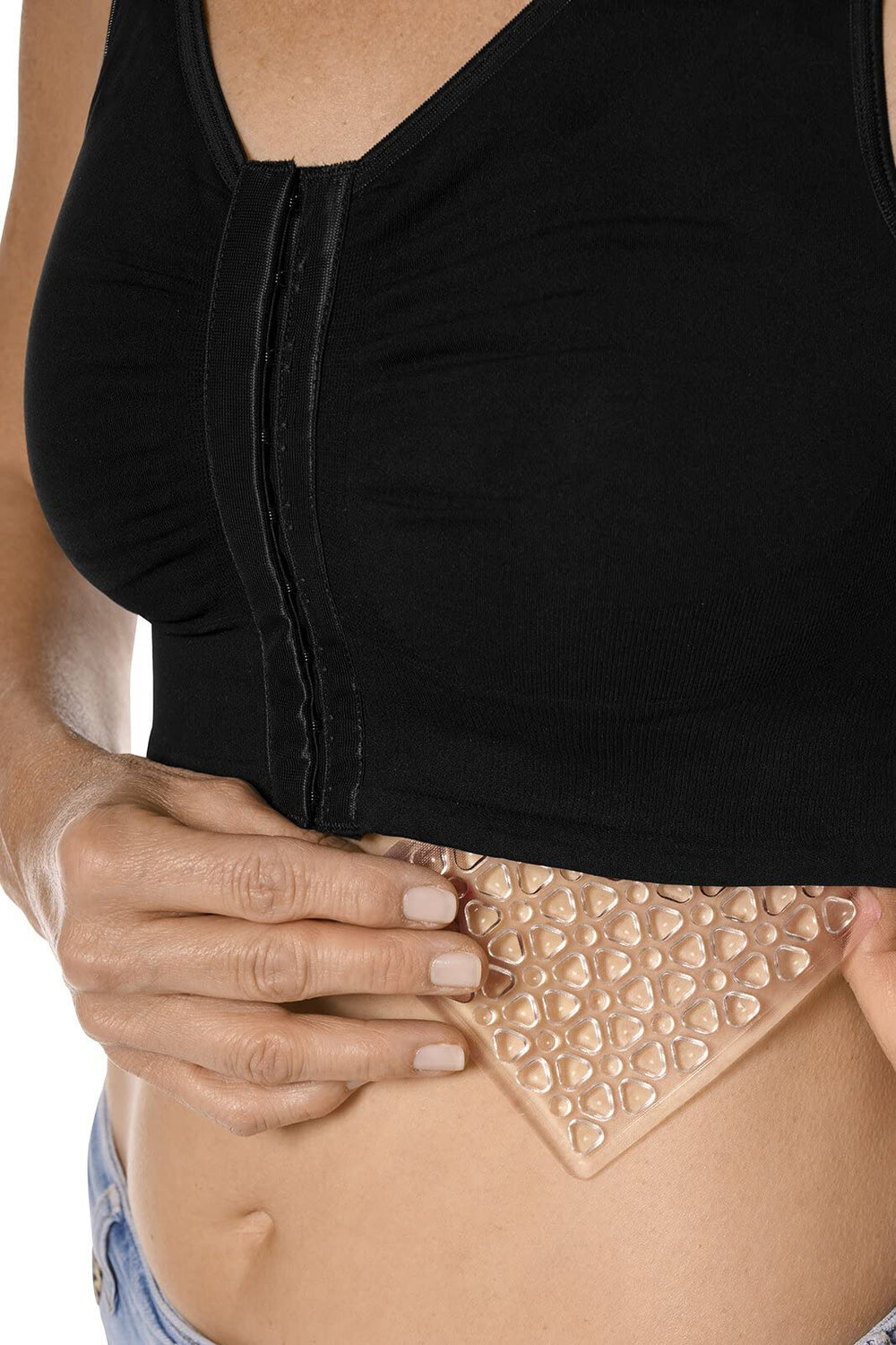 Amoena Lymph Flow pad placed in garment insert for targeted pressure.