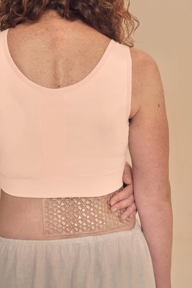 Amoena Lymph Flow Pressure Pad worn under a garment for discreet edema support.