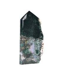 AMOYSTONE moss agate crystal tower centers a calming feng shui setup.