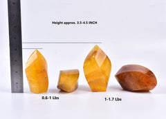 AMOYSTONE orange fluorite tower supporting altar meditation and yoga rituals.