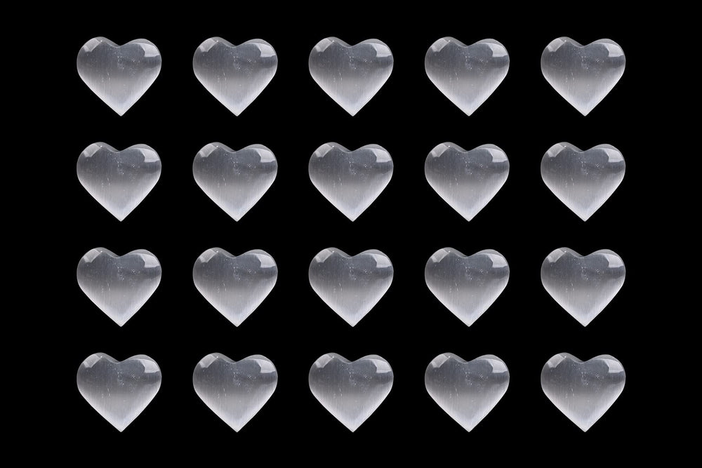 AMOYSTONE pocket-size selenite heart stone fits in hand for on-the-go balance.