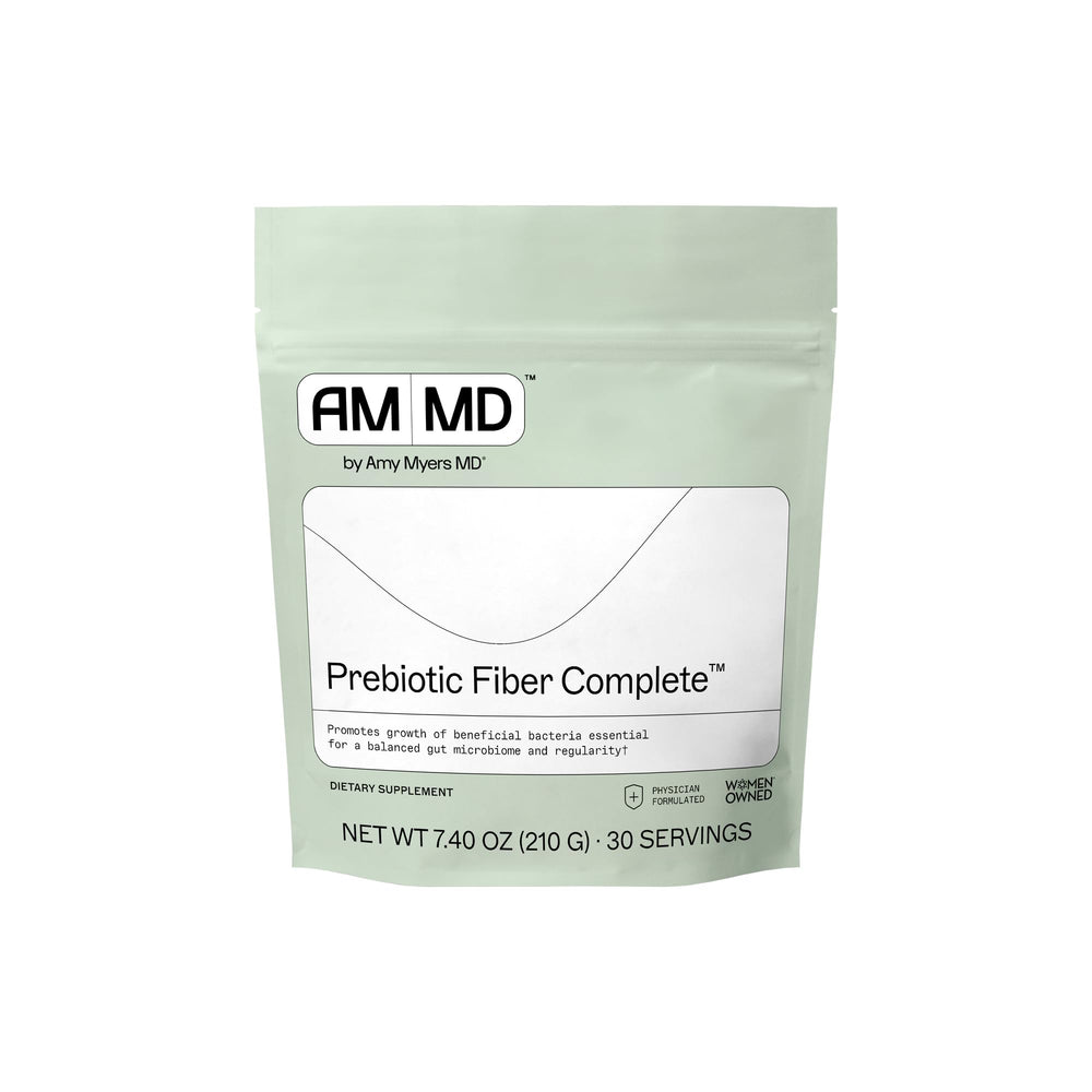 Amy Myers MD prebiotic fiber powder bottle on counter supporting gut health.