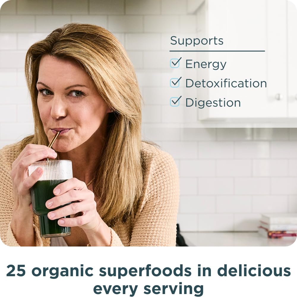 Glass of water being stirred with SuperGreens powder for quick nutrition.