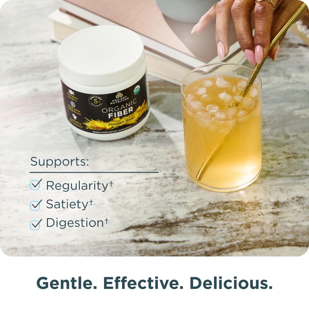 Ancient Nutrition Organic Fiber Powder pineapple mango mixed in water demonstrates easy blending.