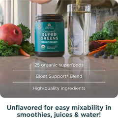 Glass with a vibrant green drink suggests on-the-go greens routine.