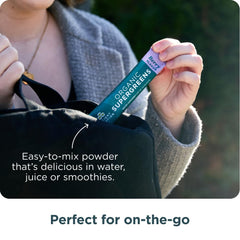 Ancient Nutrition SuperGreens powder in water, convenient daily energy and digestion support.