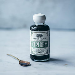 Anima Mundi Apothecary Viridem Greens Detox Elixir pour shows easy juice addition.