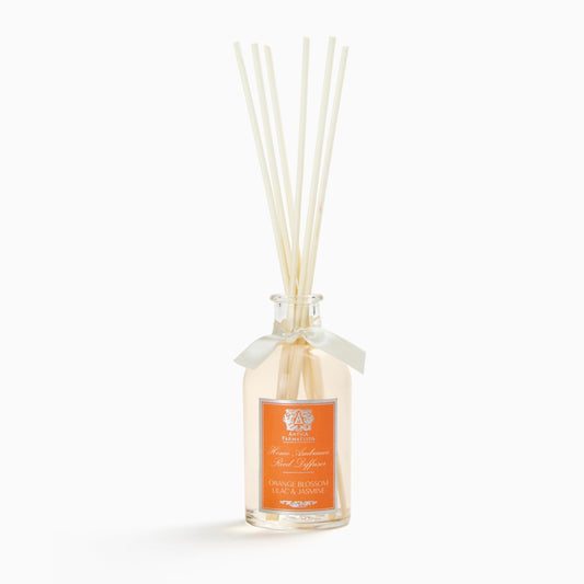Antica Farmacista Home Ambiance Diffuser bottle in an elegant glass vessel for a refined living room scent.