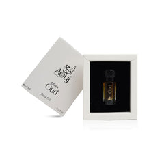 Application drops of AOUJ Dehn Oud perfume oil showing smooth, portable use.