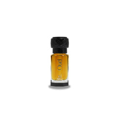 AOUJ Dehn Oud perfume oil bottle close-up; long-lasting amber warmth for evening wear.