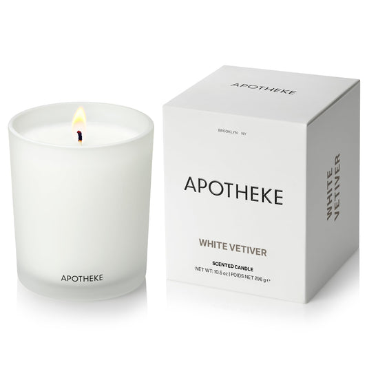 APOTHEKE White Vetiver Candle jar enhances home ambiance with timeless glass design.