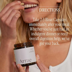 Arrae Bloat capsules pouring into hand for on-the-go use.