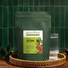Warm tea brewed from Banyan Botanicals Arjuna Bark Powder offers a comforting ritual.