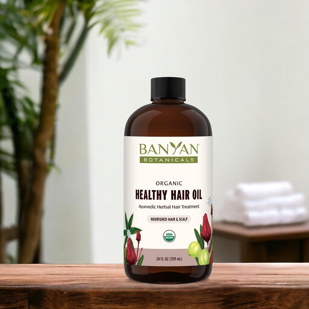 Banyan Botanicals Brahmi Oil 24 oz bottle on shelf highlighting sustainable sourcing.