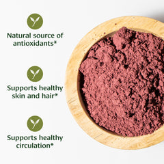 Scoop of Banyan Botanicals Hibiscus Powder for smoothies and tea infusions.