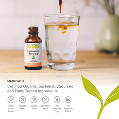 Pour of Banyan Botanicals Immune Strong into a glass, amber liquid