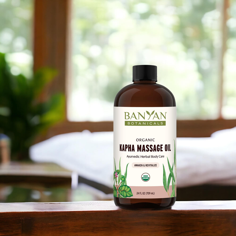 Banyan Botanicals Kapha Massage Oil warmed for winter self-massage sessions.