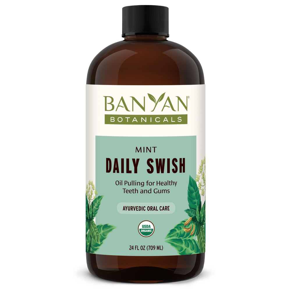 Banyan Botanicals Mint Daily Swish bottle close-up for fresh breath through daily oil pulling.