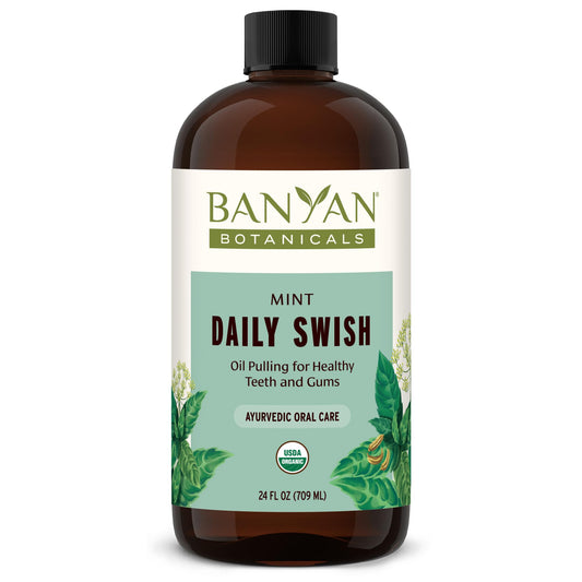 Banyan Botanicals Mint Daily Swish bottle close-up for fresh breath through daily oil pulling.