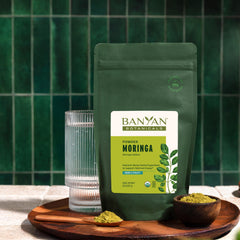 Banyan Botanicals Moringa Powder measuring spoon, precise daily servings.