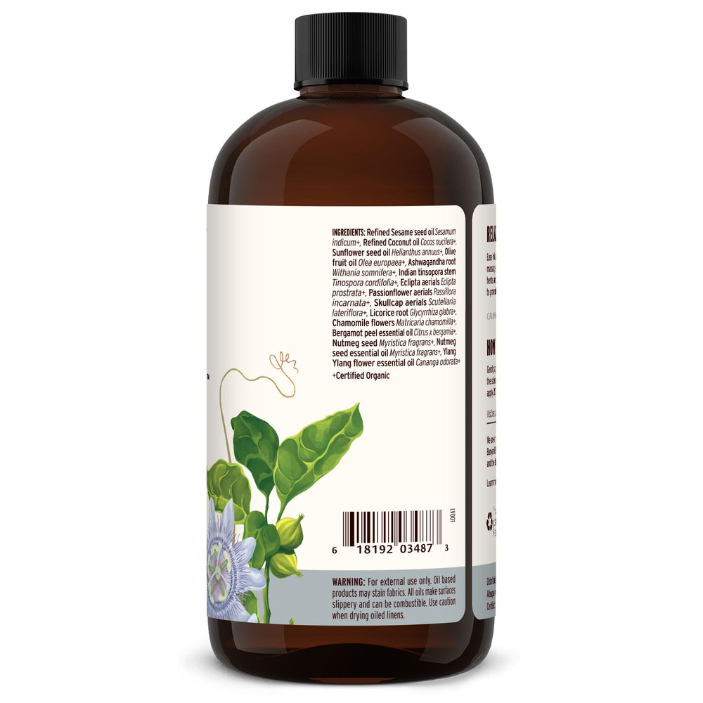 Banyan Botanicals Sleep Easy Oil bottle beside flowers to evoke calming ritual