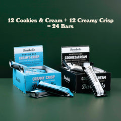 Barebells bars on desk with coffee, quick office snack.