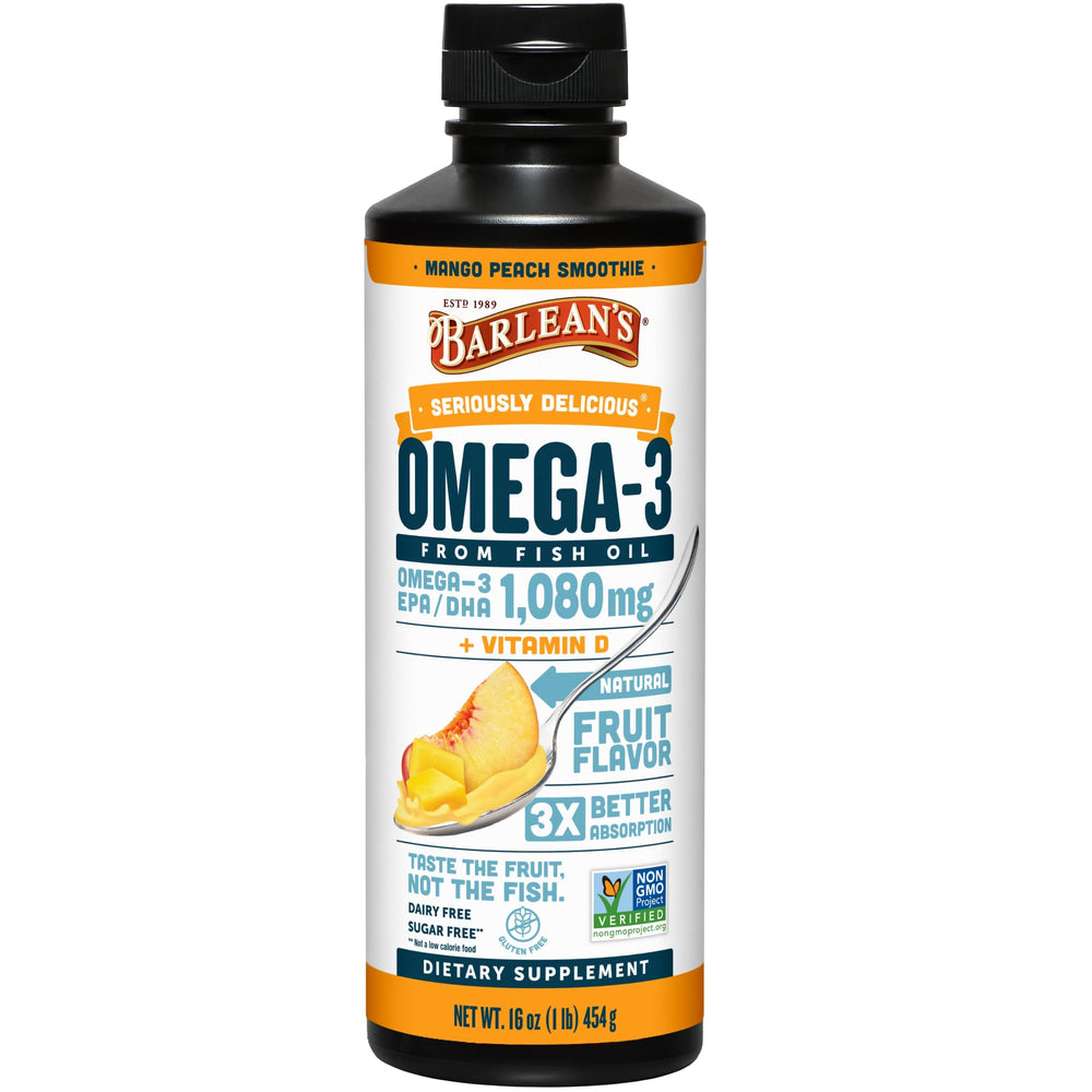 Barlean's Omega 3 Mango Peach liquid poured into a spoon for easy daily use.