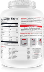 Basic Supplements whey protein isolate scoop highlighting 26g protein per serving.