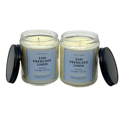 Bath & Body Works Sun Drenched Linen candle on shelf conveys bright, uplifting ambiance.
