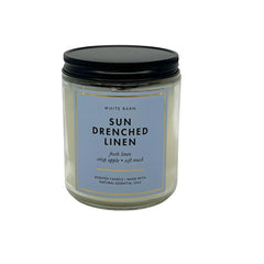 Bath & Body Works Sun Drenched Linen glow with melted wax for cozy room fragrance.