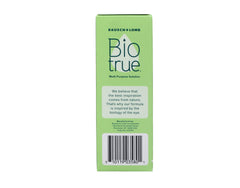 Hand holding Biotrue travel bottle, demonstrating portable care.