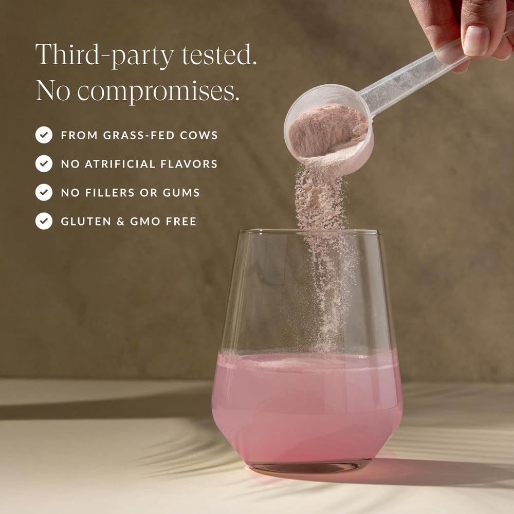 Beam Colostrum Powder in glass portrays silky texture and smooth mixing.