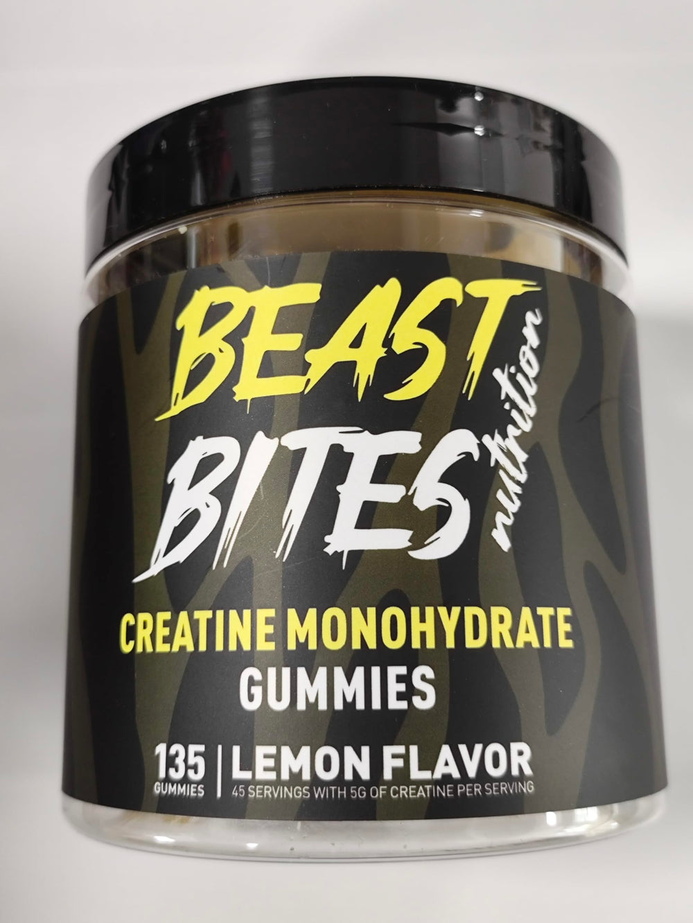 BEAST BITES Creatine Gummies lemon bottle close-up for convenient daily performance support.